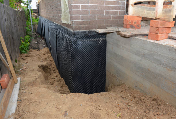 Happy homeowners after waterproofing job in Washburn